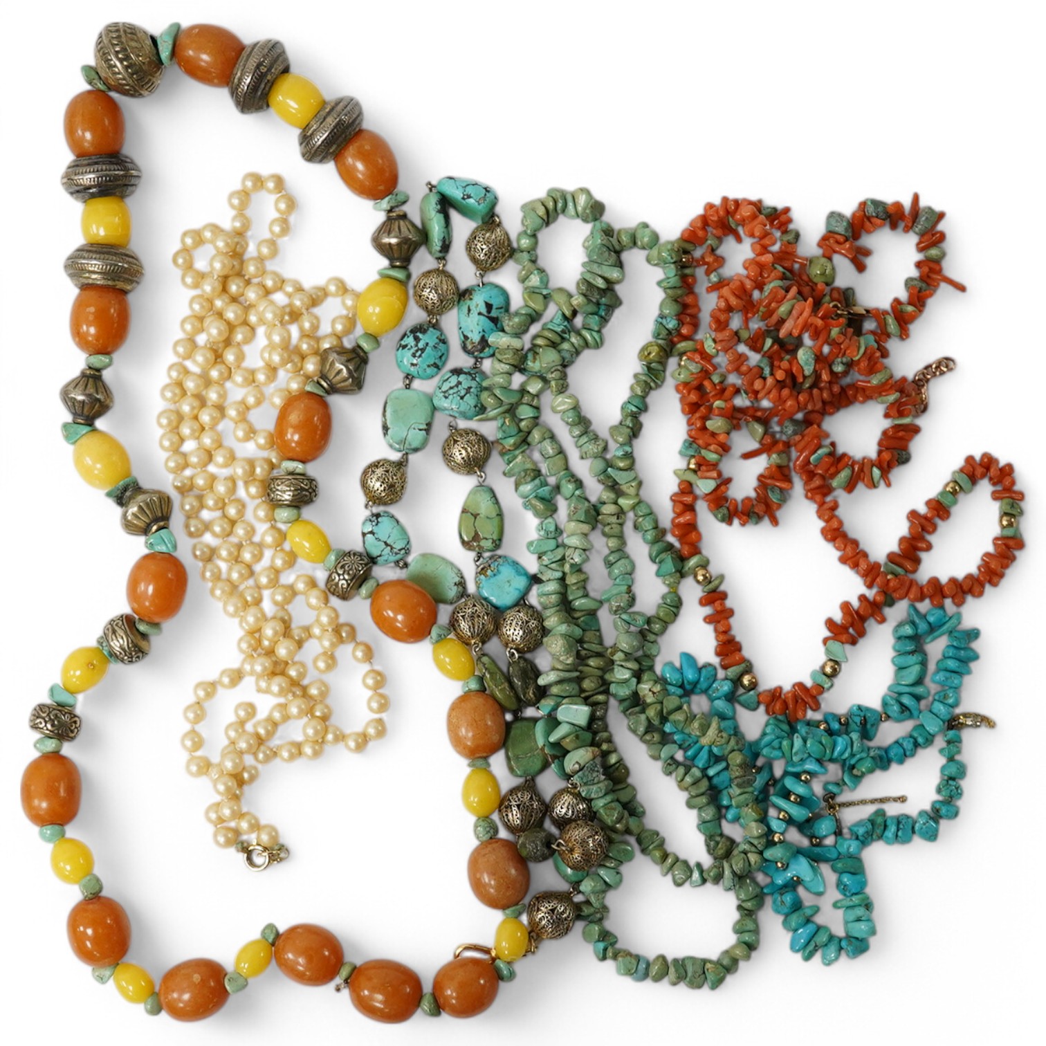 Seven assorted necklaces including turquoise and turquoise and coral longest approx. 80cm. Condition - poor to fair